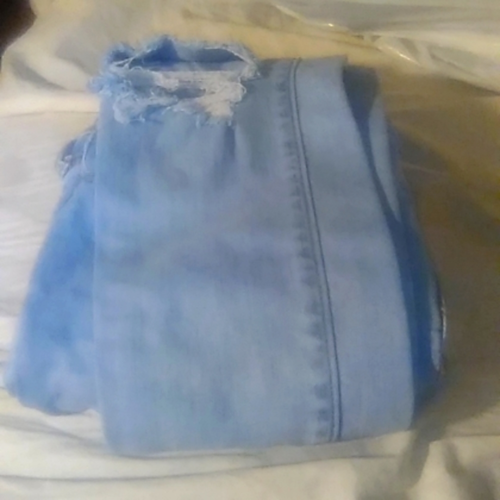 Light blue ripped jeans